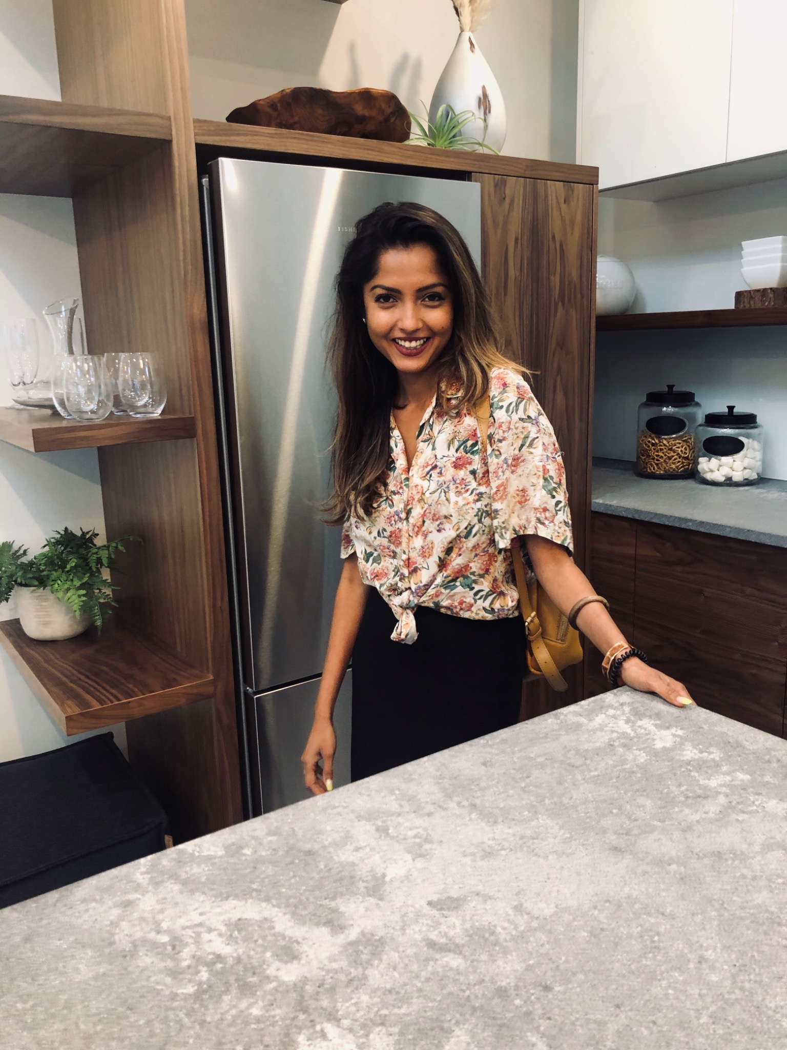 Synthia Jahan standing in the kitchen of a Vancouver home she designed.